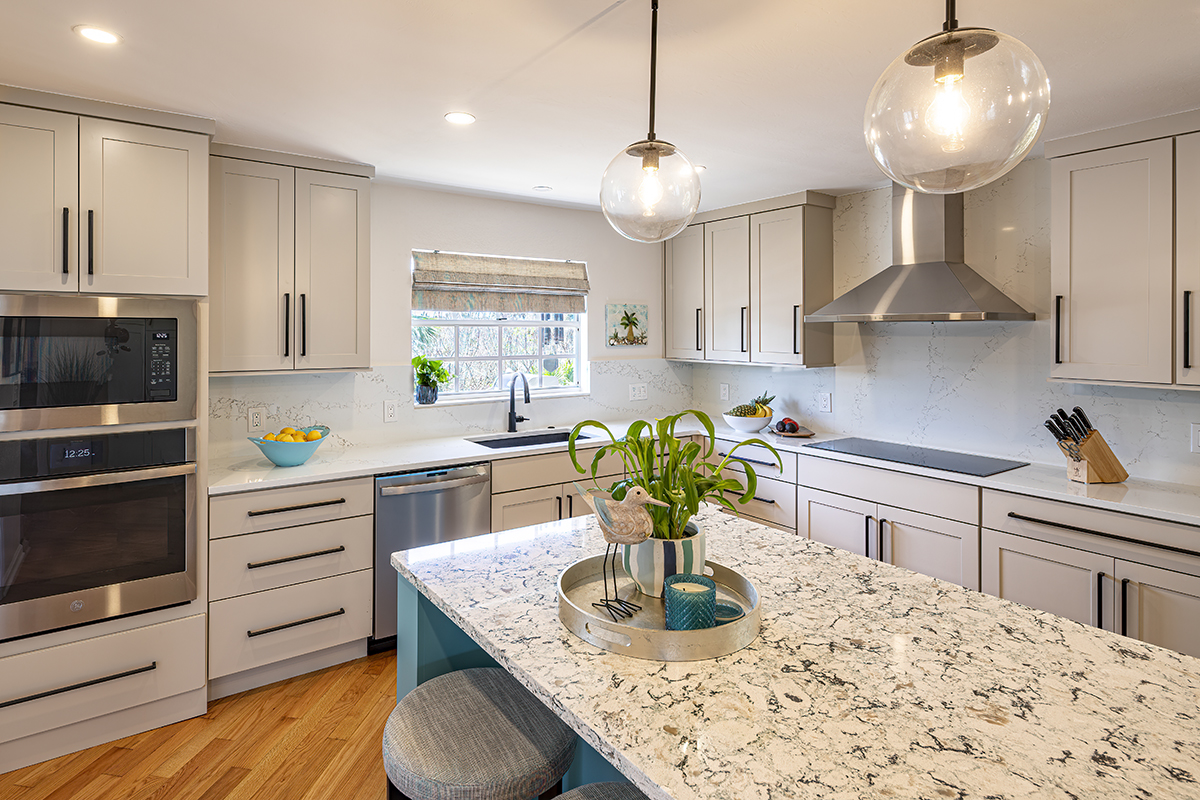white modern kitchen, colorful blue accent pieces