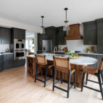 Painted kitchen with walnut island and hood