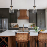 Painted kitchen with walnut island and hood