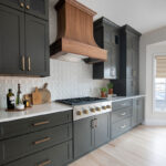 Painted kitchen with walnut island and hood