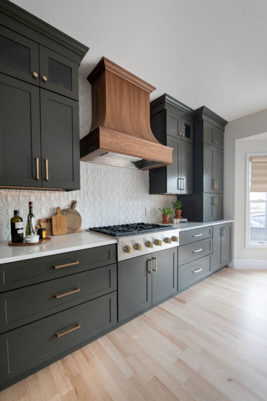 Painted kitchen with walnut island and hood