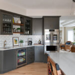 Painted kitchen with walnut island and hood