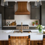 Painted kitchen with walnut island and hood