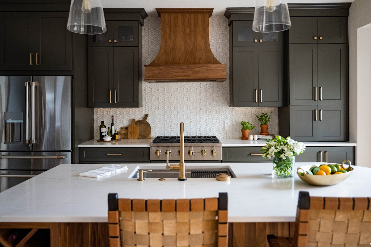 Painted kitchen with walnut island and hood