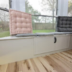 Gray window seat cabinet