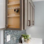 Wall cabinet with side opening storage