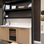 Painted bar cabinets with stained floating shelves