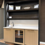 Painted bar cabinets with stained floating shelves