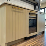 Painted bar cabinets with stained floating shelves