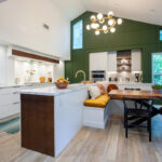 Open Space White Kitchen with accent green wall