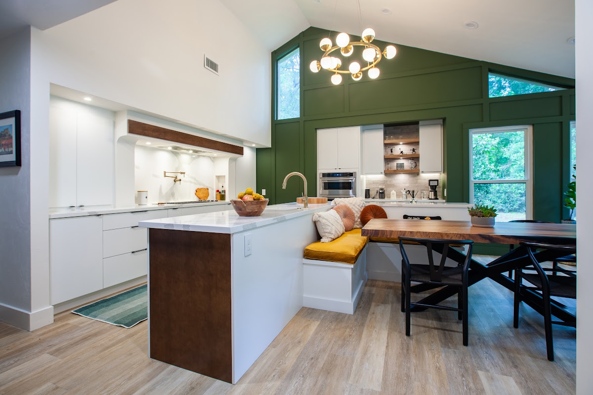 Open Space White Kitchen with accent green wall