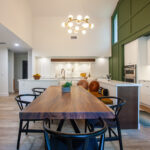 Open Space White Kitchen with accent green wall