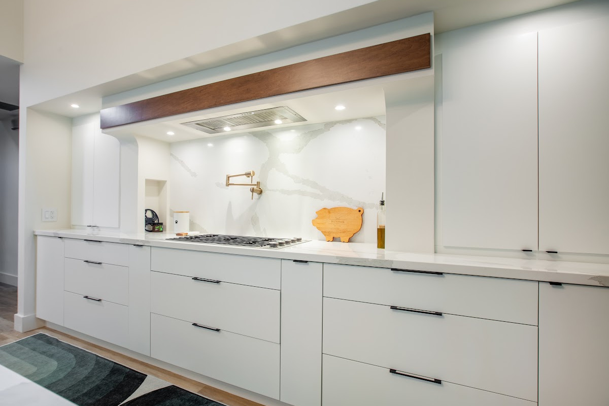 Open Space White Kitchen with accent green wall