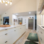 Open Space White Kitchen with accent green wall