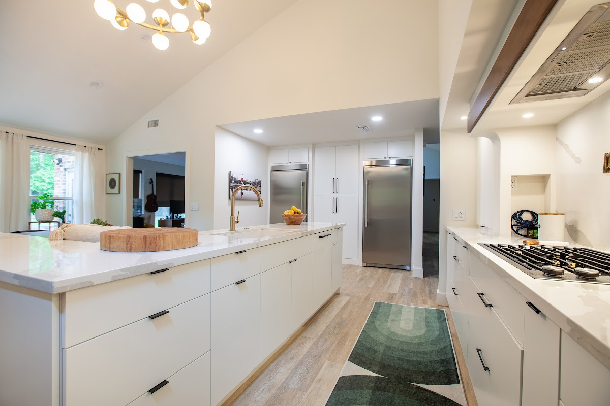 Open Space White Kitchen with accent green wall