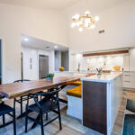 Open Space White Kitchen with accent green wall