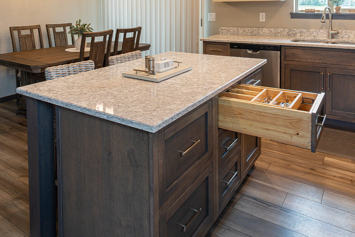 Kitchen island with silverware organizer in drawer