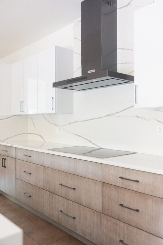 Stained kitchen cabinets with white acrylic wall cabinets