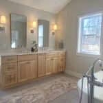 Stained bathroom vanity with standing tub