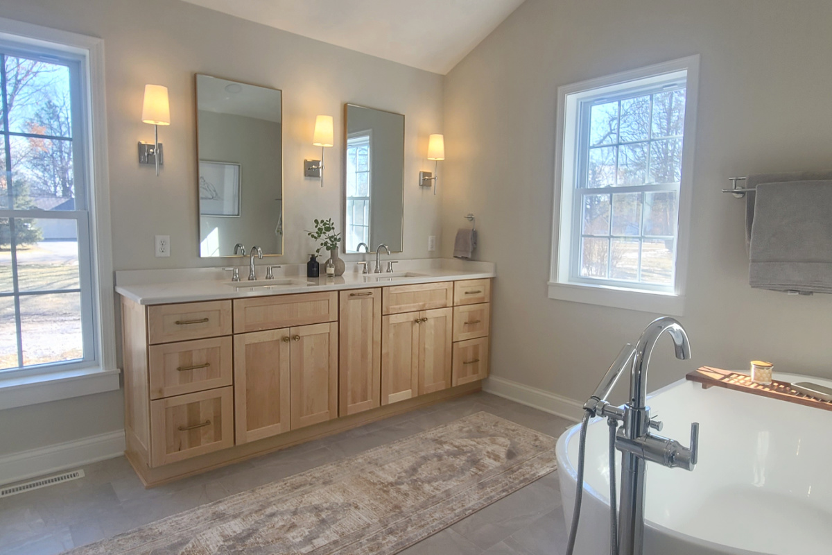 Stained bathroom vanity with standing tub