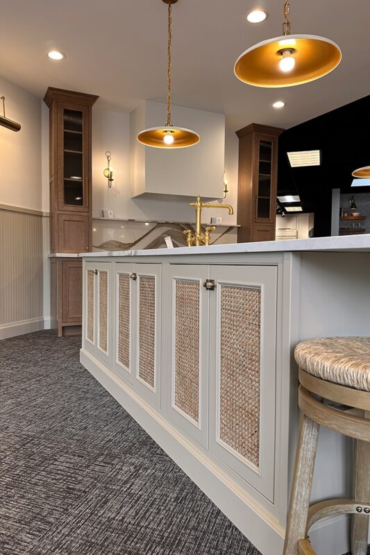 Painted island cabinets and wood hood with stained accent cabinets