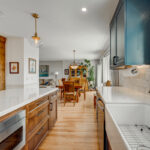 Blue painted kitchen with stained island