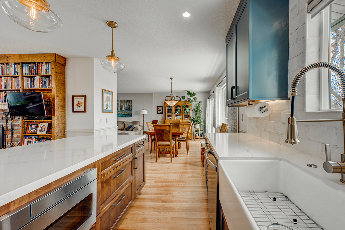 Blue painted kitchen with stained island