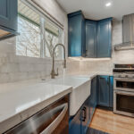 Blue painted kitchen with stained island