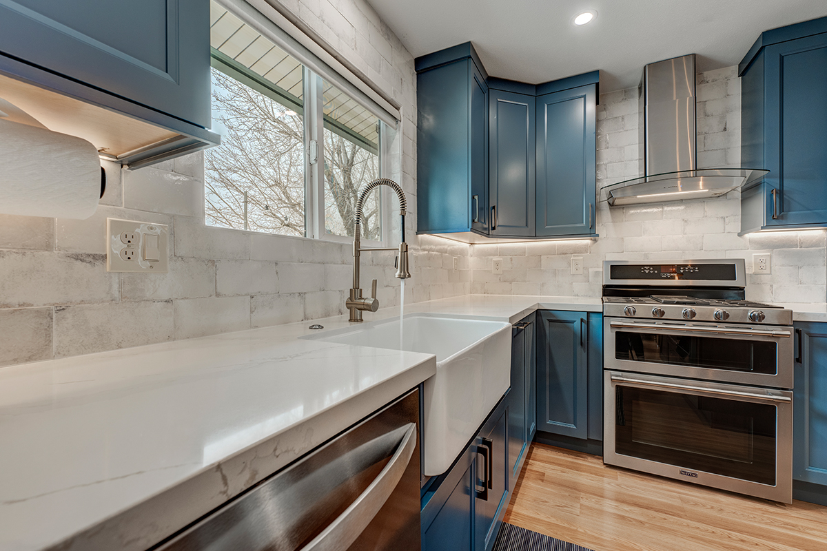 Blue painted kitchen with stained island