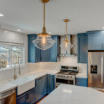 Blue painted kitchen with stained island