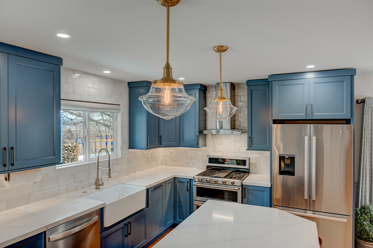 Blue painted kitchen with stained island