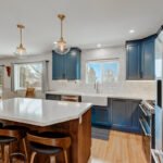 Blue painted kitchen with stained island