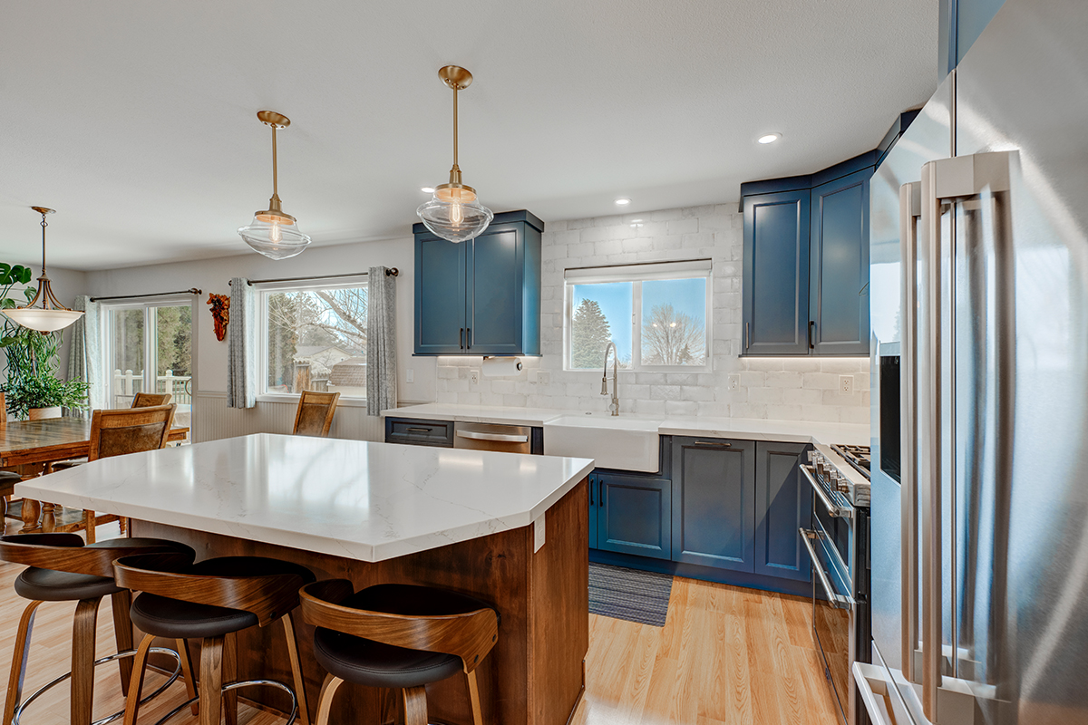 Blue painted kitchen with stained island