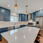 Blue painted kitchen with stained island