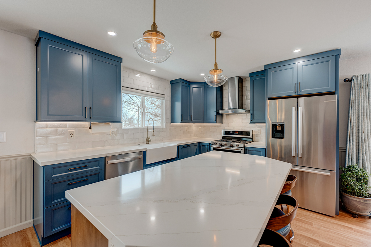 Blue painted kitchen with stained island