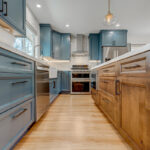 Blue painted kitchen with stained island