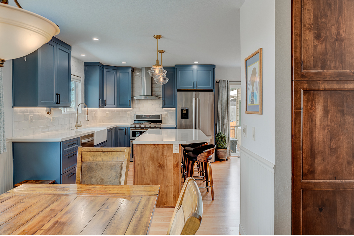 Blue painted kitchen with stained island