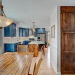 Blue painted kitchen with stained island