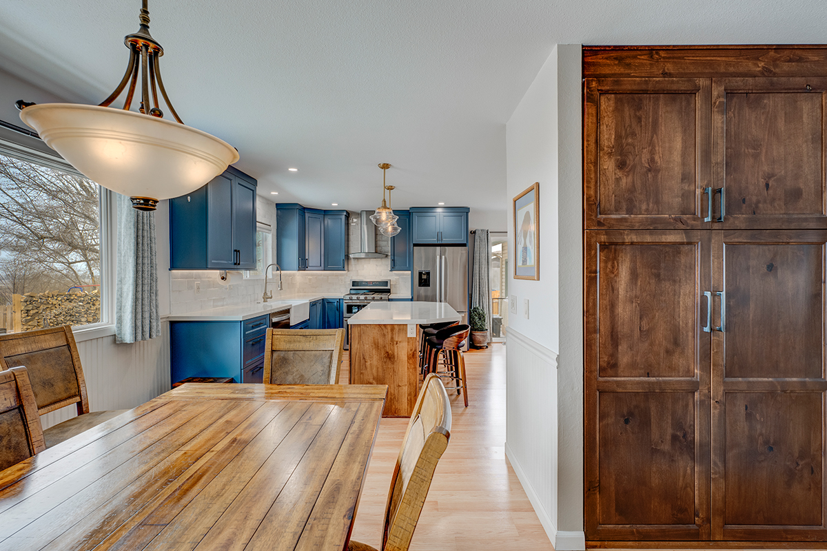 Blue painted kitchen with stained island