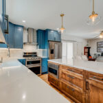 Blue painted kitchen with stained island