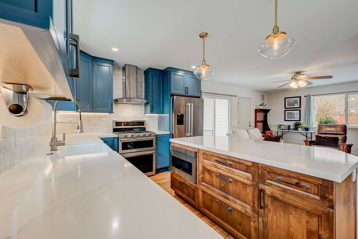 Blue painted kitchen with stained island