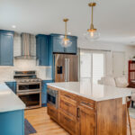 Blue painted kitchen with stained island