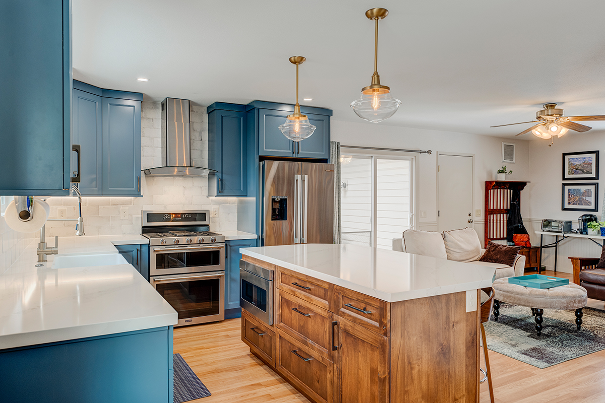 Blue painted kitchen with stained island