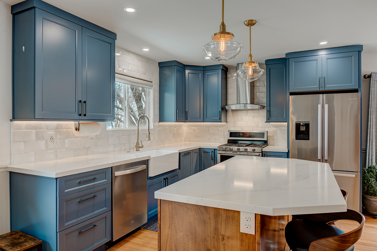 Blue painted kitchen with stained island