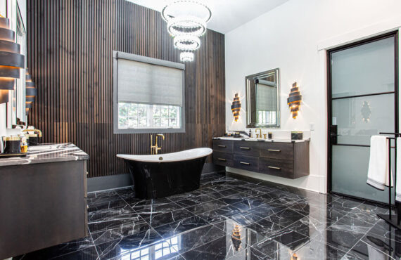 Stained master bath with floating vanities and free standing tub