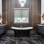 Stained master bath with floating vanities and free standing tub