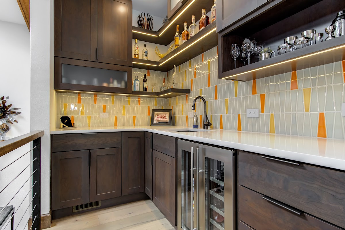 Stained kitchen cabinets with island.