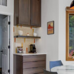 Stained kitchen cabinets with island.