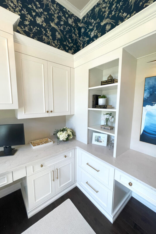 Painted white office cabinets.