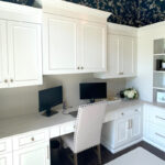 Painted white office cabinets.